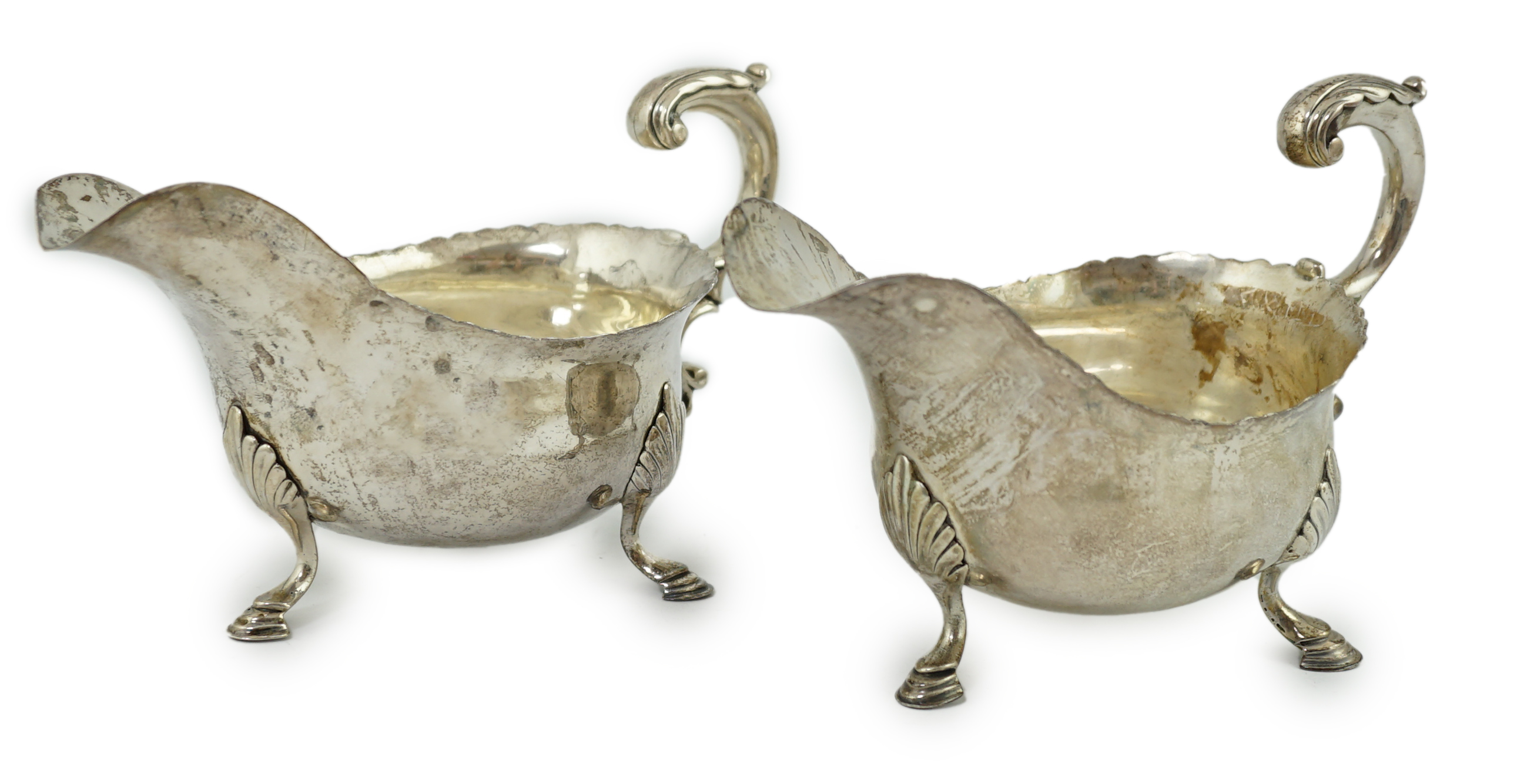 A pair of George III silver sauceboats